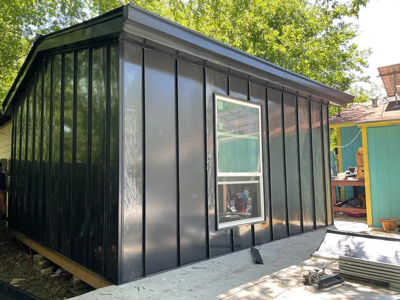 Black standing seam metal wall panels for Roof Inspection in Bellwood